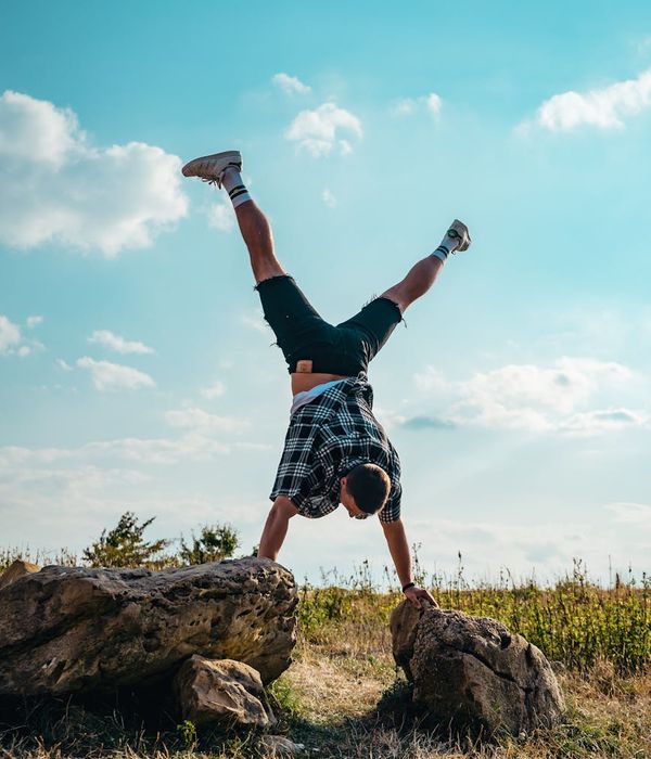 Man performing a controlled strength exercise in a bright, clean environment.